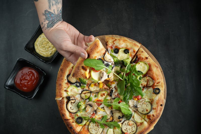 BBQ chicken pizza with fresh toppings at Dewey's pizza